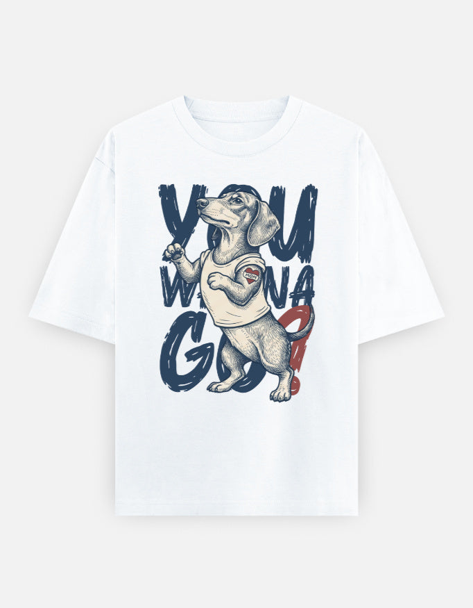 A white short-sleeve crewneck t-shirt featuring a graphic print of a dachshund wearing a 'Wonga' bandana, surrounded by the text 'YOU WON A G.