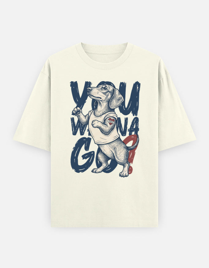 An off-white short-sleeve t-shirt featuring a graphic print of a dachshund wearing a tank top with the text 'YOU WANG G' in dark blue and red.