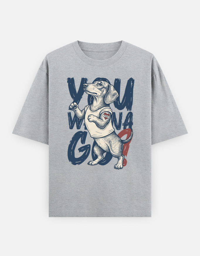 A heather gray short-sleeve t-shirt with a graphic print of a dachshund wearing a white t-shirt with 'YOU WIN A GO' text in navy blue and red, displayed on a light gray background.